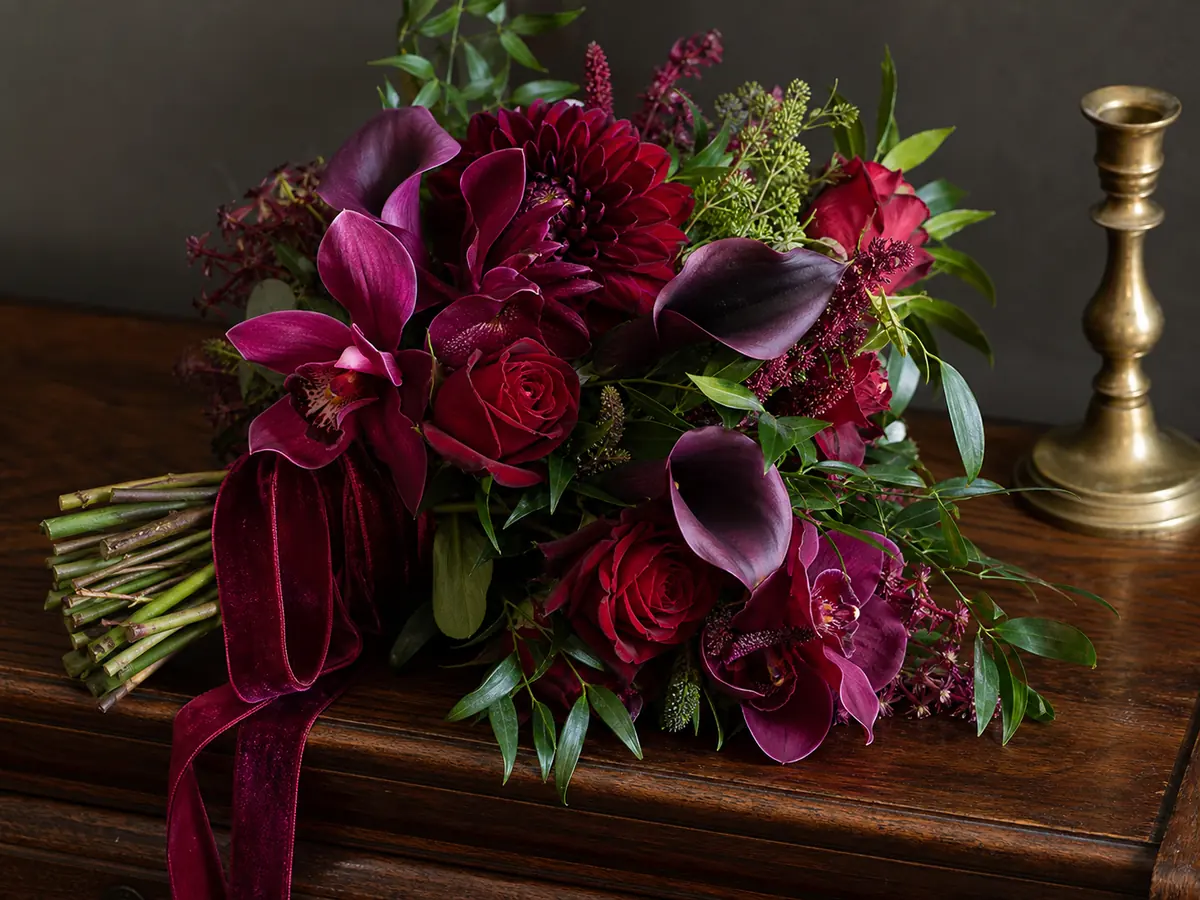 Jewel-tone bouquet combining burgundy, plum, ruby and emerald green