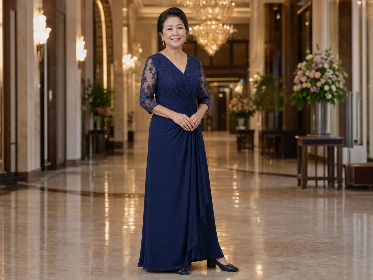 A mother in a comfortable navy evening gown with lace sleeves and flattering waist draping